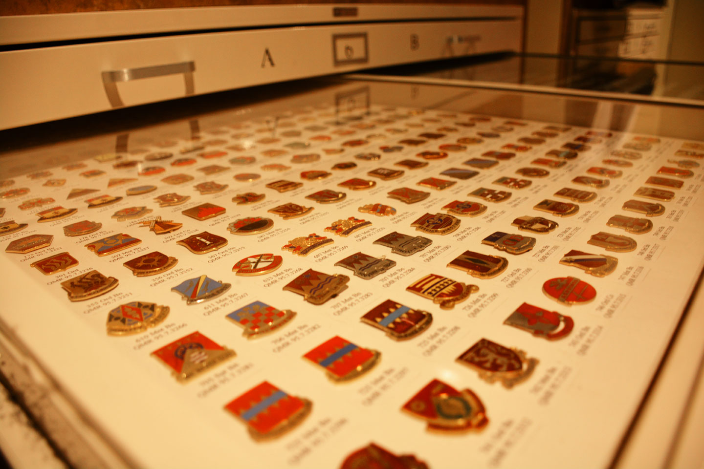 A drawer full of US Army pins at the US Army Quartermaster Museum.